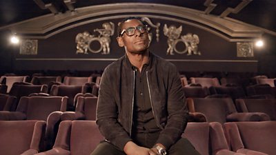 David Harewood sits in a theatre