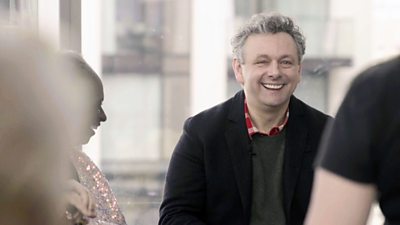 Michael Sheen laughs with contributors while filming for The Assembly 