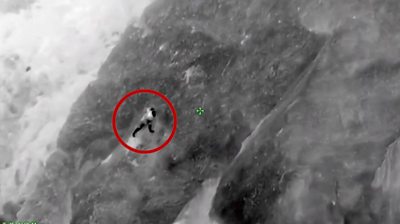 Man clinging from cliff in California