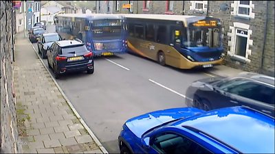A bus mounts a kerb