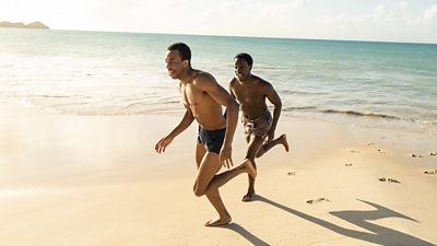 Keenan Munn Francis and Gabin Kongolo as young Barrington and young Morris, running along a beach