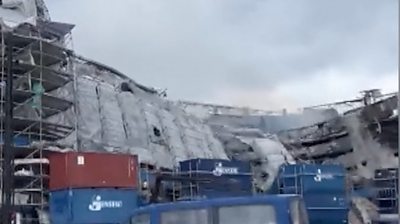 Building covered in scaffolding collapses