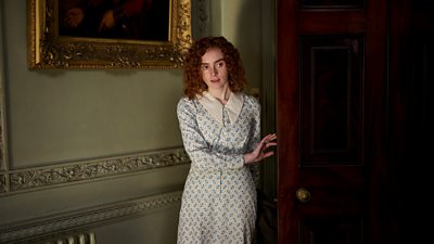 Evie Galloway (EILIDH FISHER) walks into a grand room