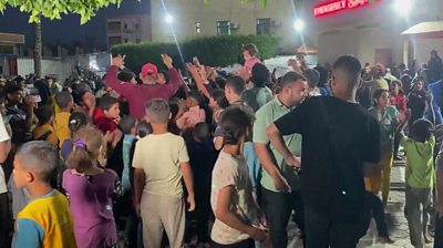 People celebrate outside Al Aqsa hospital