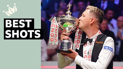 Kyren Wilson kisses the World Snooker Championship trophy