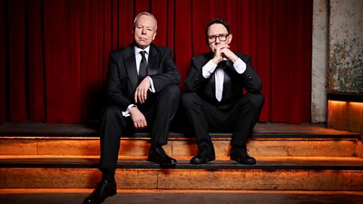 Steve Pemberton and Reece Shearsmith sat on steps, looking to camera