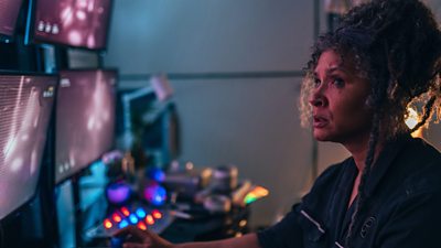 Golda Rosheuvel as Jocelyn . She stares at screens she's monitoring, looking concerned.