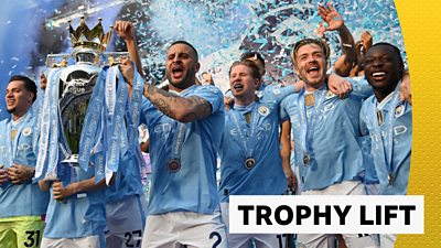 Kyle Walker lifts the Premier League trophy for Manchester City