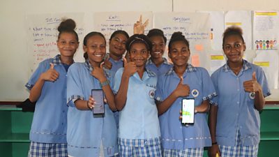Girls using the Oky app at school in Papua New Guinea 