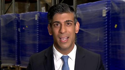 Rishi Sunak wearing a suit and a blue tie