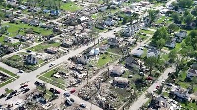 Drone shows path of destruction after deadly Iowa tornadoes - BBC News