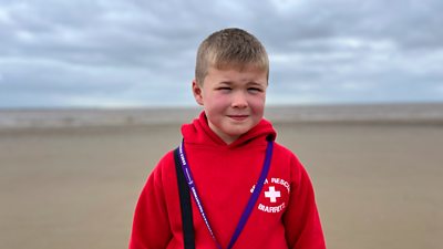 Dom, who makes beach safety videos, standing on Burnham-on-Sea beach