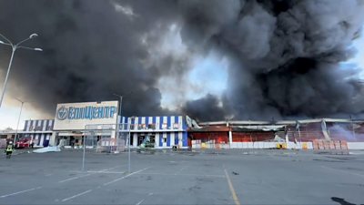 A large fire can be seen raging at the Epicentr K home improvement store