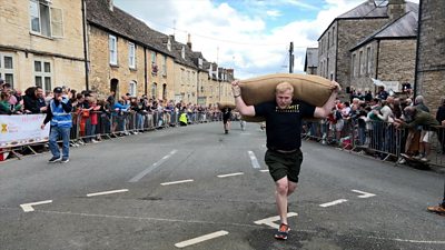 A man running with a sack of wool on his back
