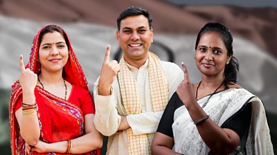 People showing ink marks on their fingers to prove that they have voted