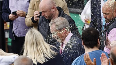 Farage has drink thrown at him