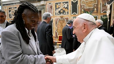 Whoopi Goldberg shakes hands with Pope Francis