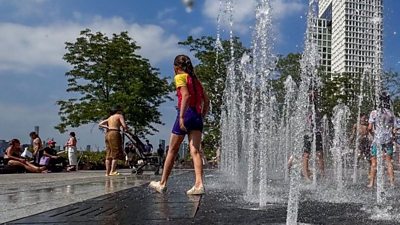 Kids play at splash pad in New York City