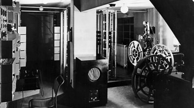 A huge reel to reel machine in a 1930s equipment room