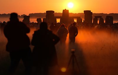 People watching sunrise at Stonehenge