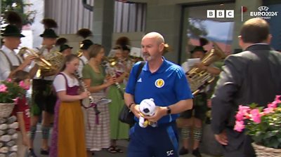 A sombre Steve Clarke and his men were played out of the German hotel to a series of upbeat numbers following their Euros exit.