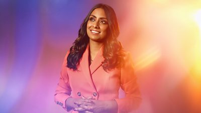 Composite image of Isa Guha smiling and looking up and away from the camera. She's wearing a dusty pink blazer buttoned. up.  Background of blurred pastel pinks and purples