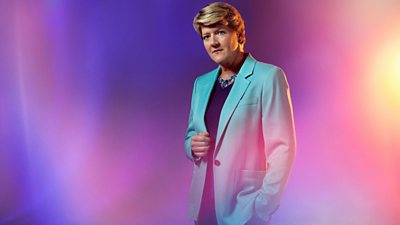 Composite image of Clare Balding looking to camera. she's wearing a pale blue blazer.  Background of blurred pastel pinks and purples