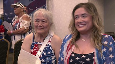 Two women voters at a watch party dressed in US flag outfits