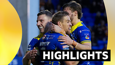 Warrington players celebrate a try against Huddersfield