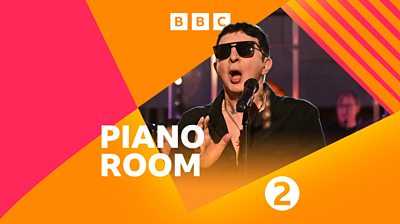 composite image of Marc Almond singing into a microphone wearing sunglasses. Piano Room in bold white text with orange and pink graphics 