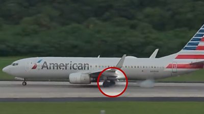 Red circle around tyres of an American Airlines plane