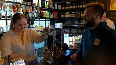 Thomas J Vosper at the bar in a pub