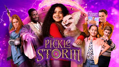 composite image of young girl holding a magical pig type creature. People either side of her. Three grown ups, one holding a weapon in the air, one with magic coming out of his fingers and one holding a book.  Two kids to the right smiling. Pickle storm in text with a purple magical background