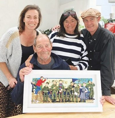 Paul Joel is holding the picture and behind him from left to right are his daughter Bethany, wife Judy and son Tim.