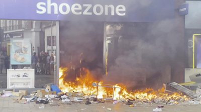 A Shoezone store on fire