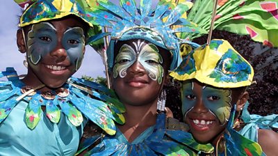 Three people in Carnival costume