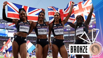 The women's 4x400m relay team celebrating bronze