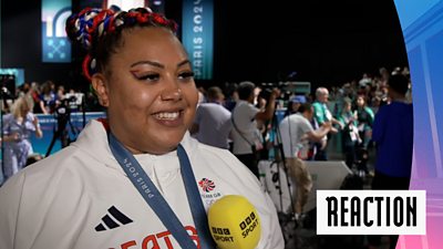 Watch as Team GB's Emily Campbell reacts to winning bronze in the women's +81kg weightlifting.