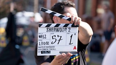 a clapperboard that has Sherwood 2 on it