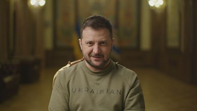 President Zelensky wearing a khaki green jumper that says I'm Ukrainian on it 