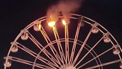 Video shows two carriages on the wheel in Leipzig alight with smoke billowing into the air.