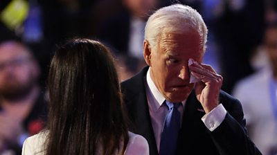 Biden wipes his eyes with a tissue and greets daughter