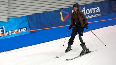 Annabel on an indoor slope, skiing with a prosthetic leg