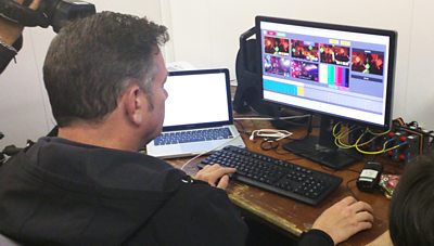 Ian Wagdin operates the production tool on a computer