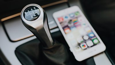 Car gearstick and mobile phone