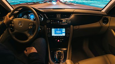 A car interior showing a dashboard with the entertainment system centred.