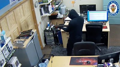 Hooded gunman inside business