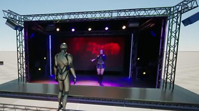 Another screenshot of the same virtual scene - this version shows a higher definition and better quality image - the music artist is on stage and a single 'Robocop'-style avatar watches from the audience.