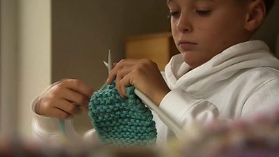 Joshua knits to help others