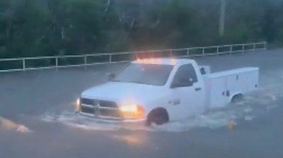 White truck submerged in floodwater